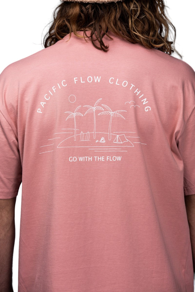 A rose coloured shirt with an island on the back, with surfboards, a fire, palmtrees, a tent, and waves to surf.