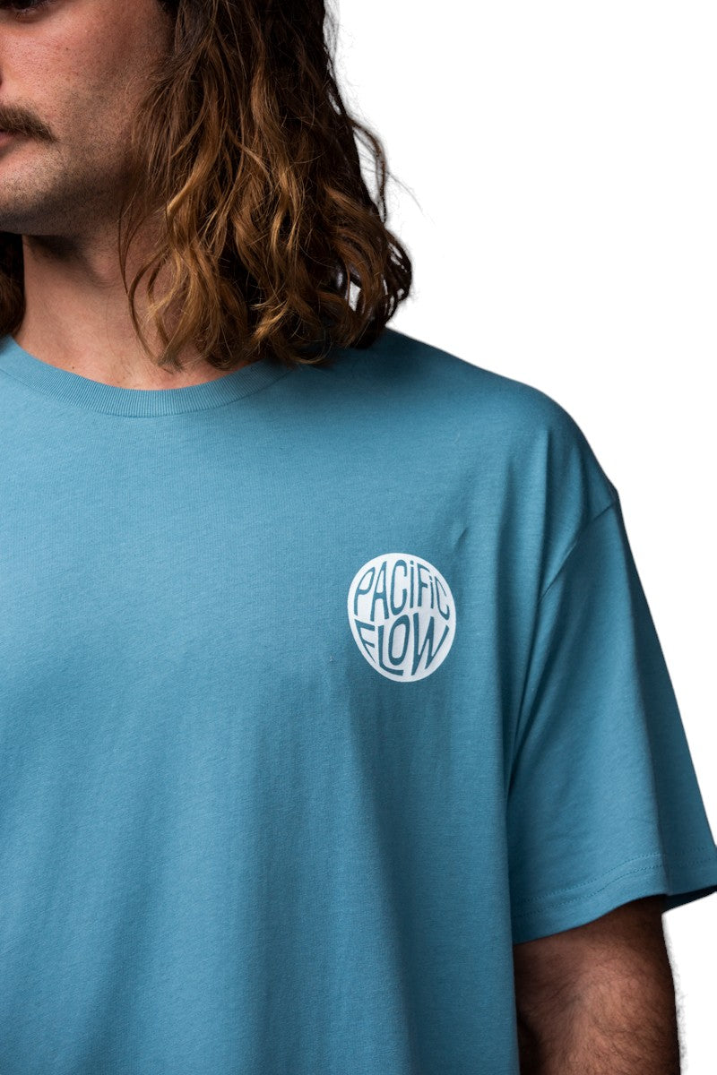 A front logo shirt with the words pacific flow in it.