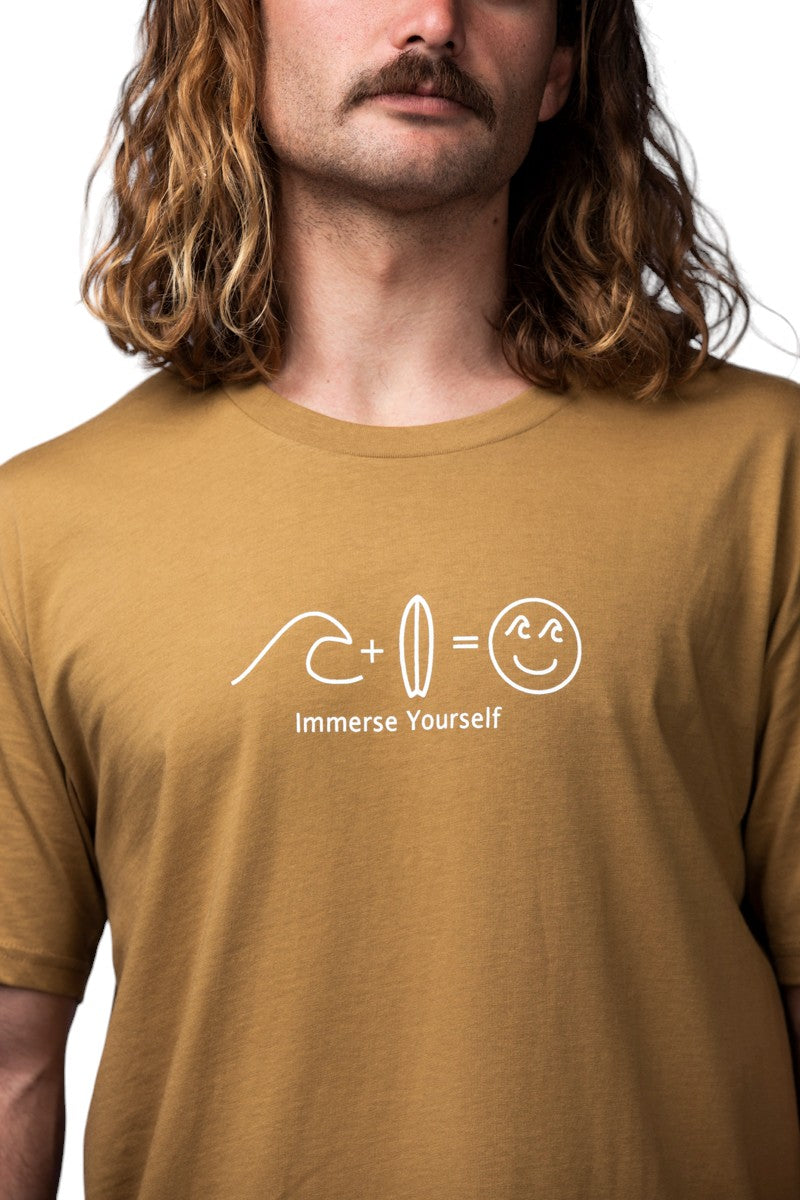 Camel coloured tshirt with a front logo. The logo has a wave, a surfboard and a smiley face with waves as eyes.